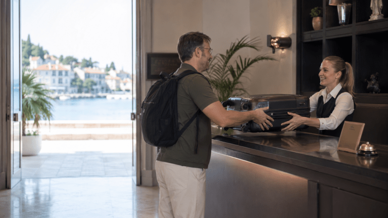 Traveler using luggage storage in Cavtat before exploring the waterfront and harbour