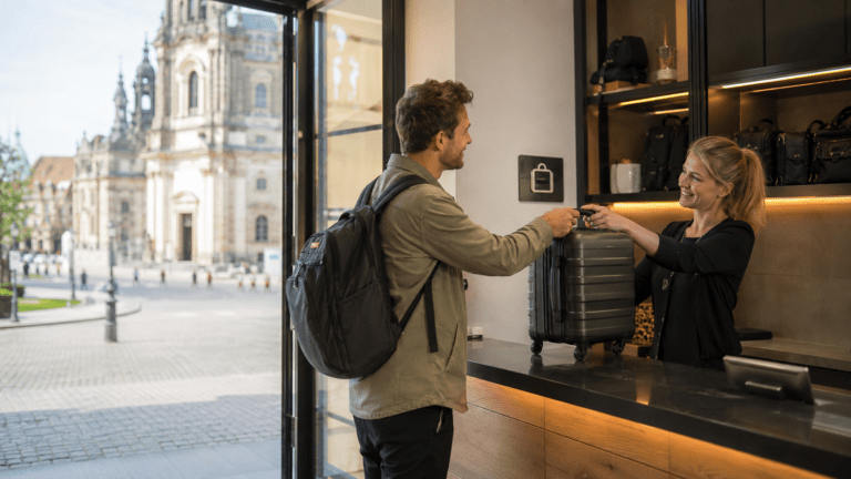 Traveler using luggage storage in Dresden before exploring the Frauenkirche and Elbe riverfront